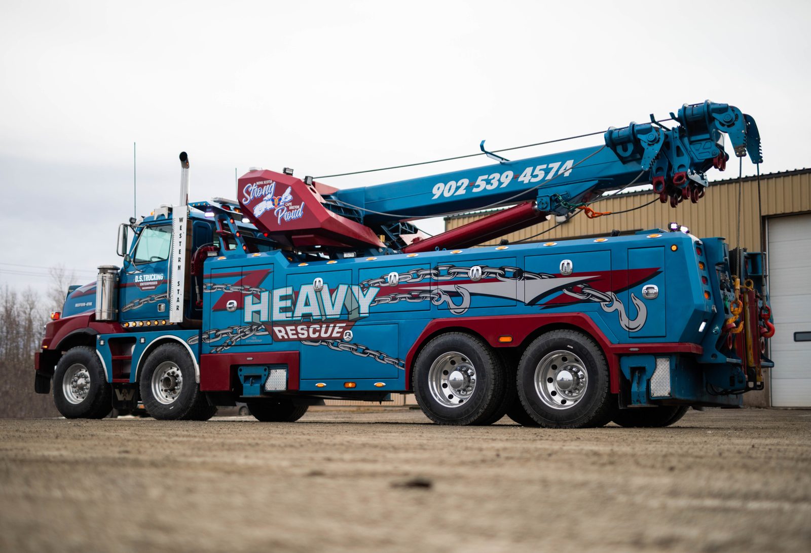 Atlantic Truck 50-ton rotator boom extended at recovery scene